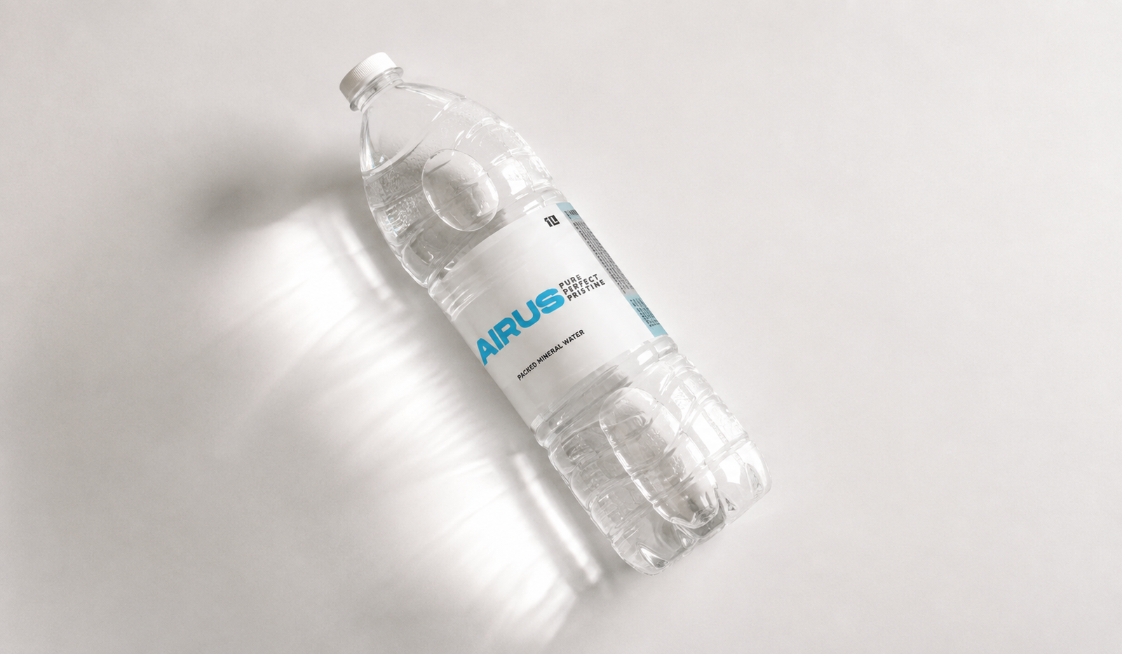 Airus 1L mineral water bottle lying diagonally with branded label