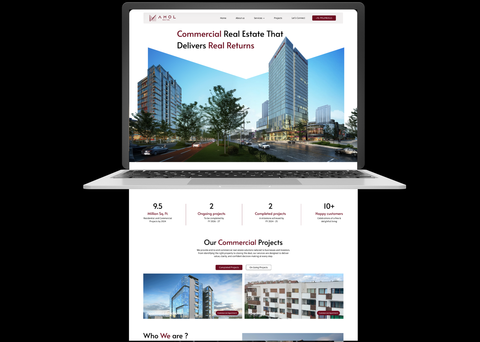 Amol Realtors website on a laptop with continuing page scroll